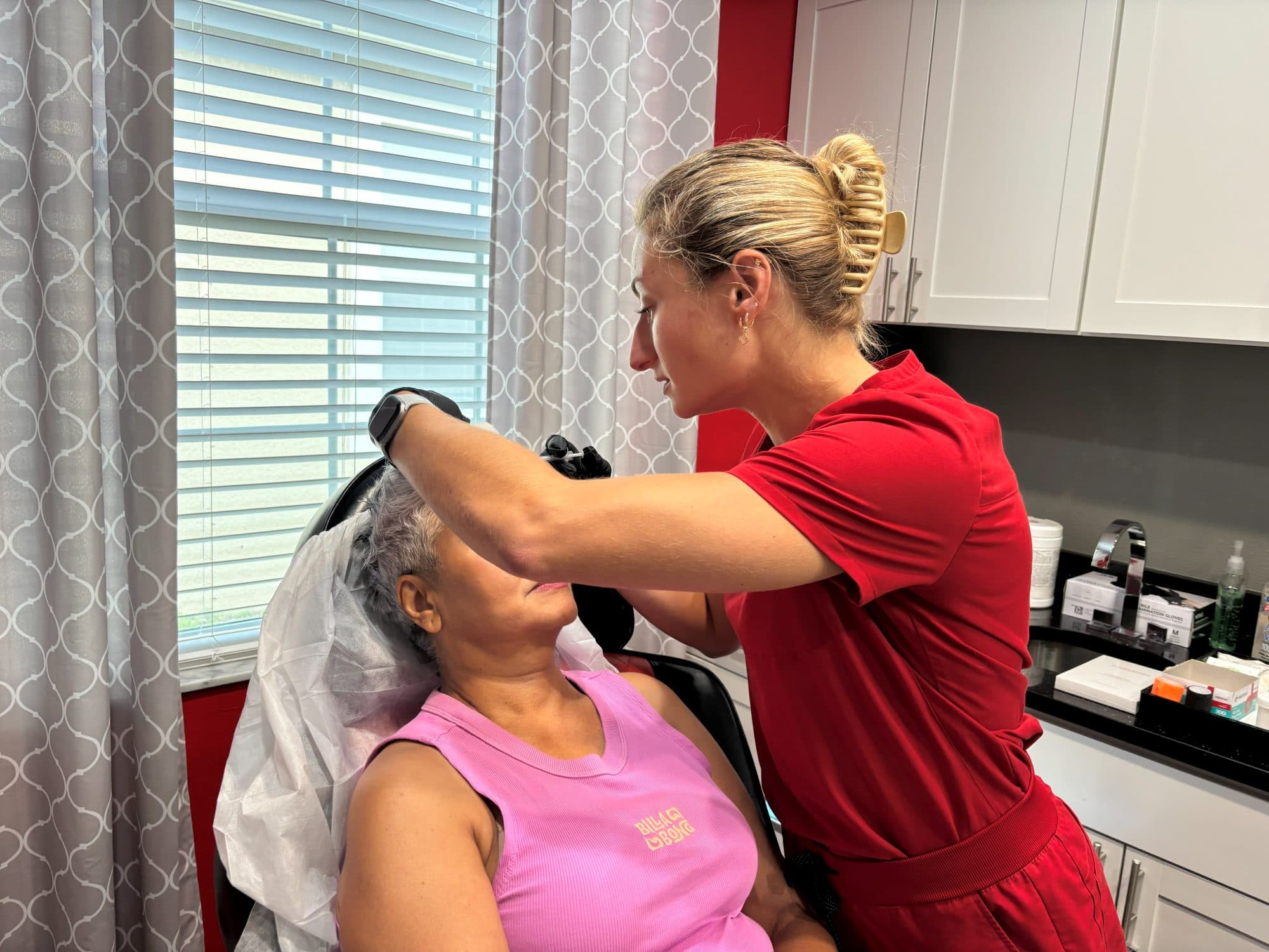 A Padgett Medical Center provider performing a facial aesthetic treatment at the Tampa clinic